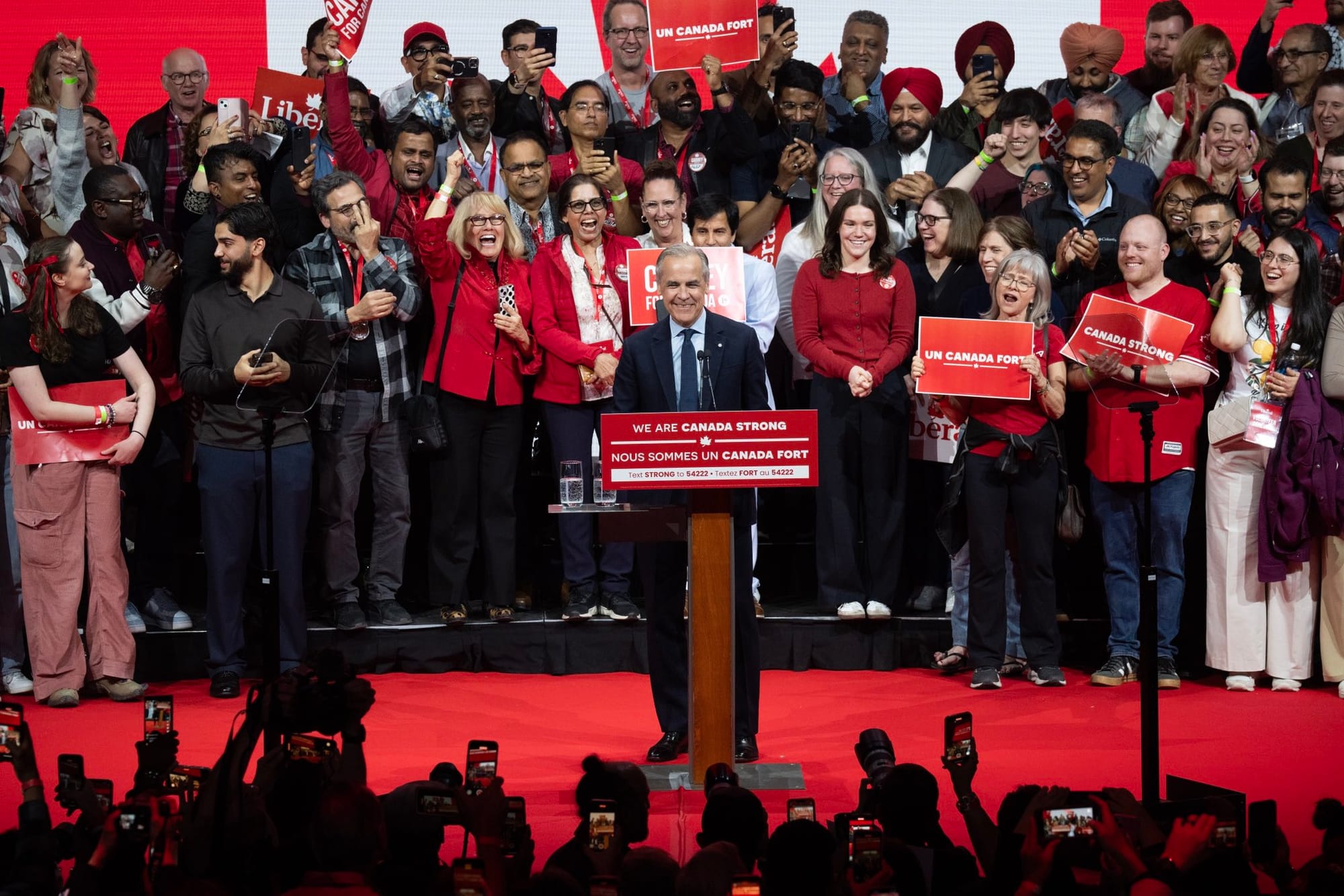 Mark Carney surrounded by supporters at his victory rally